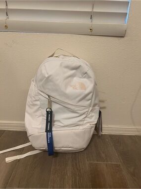 The North Face Beige and Black Product Tag